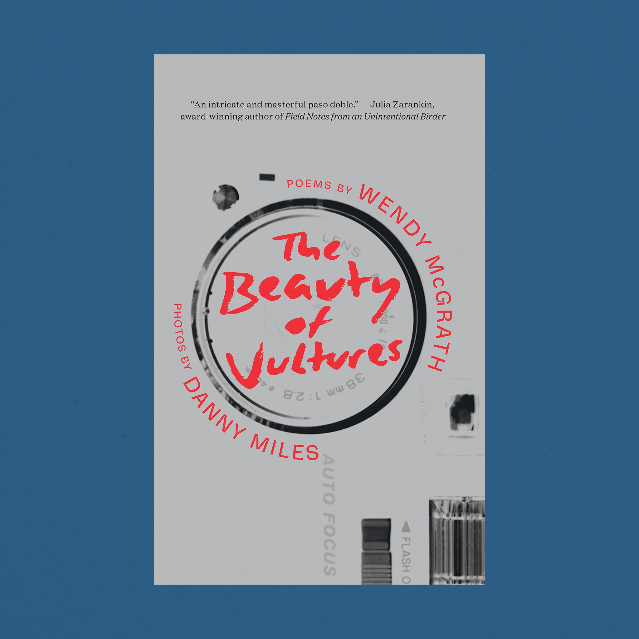 Book Cover: The Beauty of Vultures poems by Wendy McGrath and photos by Danny Miles. The background is grey with old-fashion camera details in the right-hand side. The title "Beauty of Vultures" rests within the 'lens" in red. The author names — Wendy McGrath and Danny Miles  —  circle the circumference of the 'lens'.